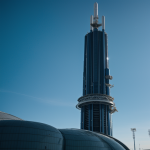 An awe-inspiring alien tower stretching into orbit, showcasing extraterrestrial engineering against the backdrop of space.