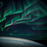 A vibrant aurora illuminating Jupiter's poles, showcasing the planet's dynamic magnetic field and atmospheric phenomena.