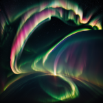 A breathtaking view of a gas giant planet showcasing vibrant rainbow auroras illuminating its atmosphere against the dark expanse of space.