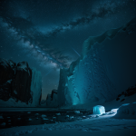 A breathtaking view of ice cliffs illuminated by starlight, creating a serene and magical nighttime landscape that inspires awe and tranquility.