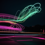 A stunning display of neon light streaks curving gracefully, creating a captivating and colorful visual art piece that embodies dynamic motion and modern design.