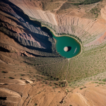 A planet featuring a massive canyon scar, showcasing stunning geological formations and the planet's intriguing history.
