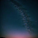 A simple yet captivating image of a pastel gradient sky filled with twinkling stars, blending soft hues of pink, blue, and purple, creating a serene celestial scene.