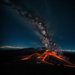A breathtaking volcanic eruption illuminating the night sky, with fiery lava flows and a backdrop of twinkling stars.