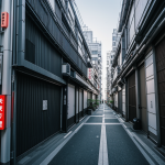 A vibrant futuristic alley in Tokyo, illuminated by neon lights, showcasing the unique blend of modern architecture and traditional Japanese elements.
