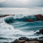 A stunning view of powerful ocean waves crashing against rugged rocks along the coastline, capturing the essence of nature's dynamic beauty and force.