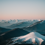 A minimal gradient mountain scene with soft hues and gentle slopes, capturing the tranquil beauty of nature in a serene and calming landscape.